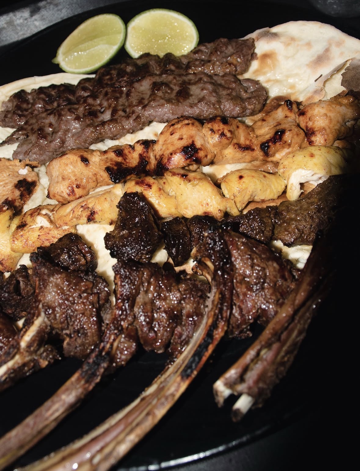 Mixed grill platter with lamb chops, chicken and koobideh